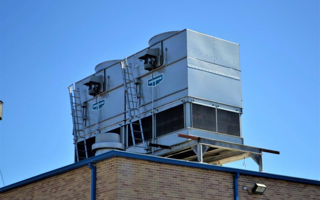 an older commercial hvac unit on top of a commercial building